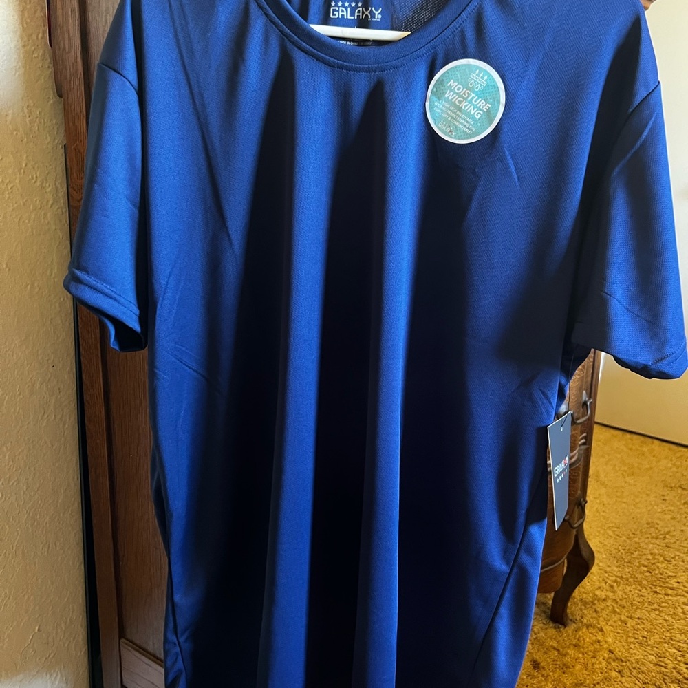 Brand new men’s Galaxy shirt. Beautiful blue color. 100% polyester.